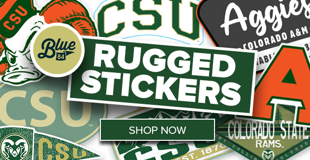 A variety of CSU Rams stickers are in the background. Text reads RUGGED STICKERS with a Blue 84 logo and shop now button