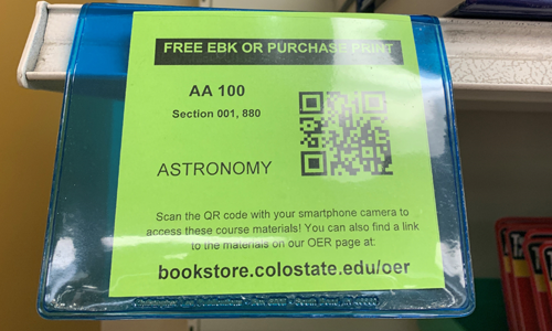image of a QR code shelf tag on the sales floor of the CSU Bookstore.